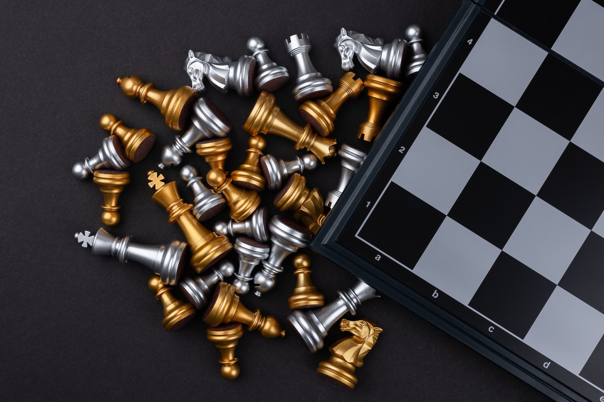 empty chess board and fallen chess pieces, business strategy concept