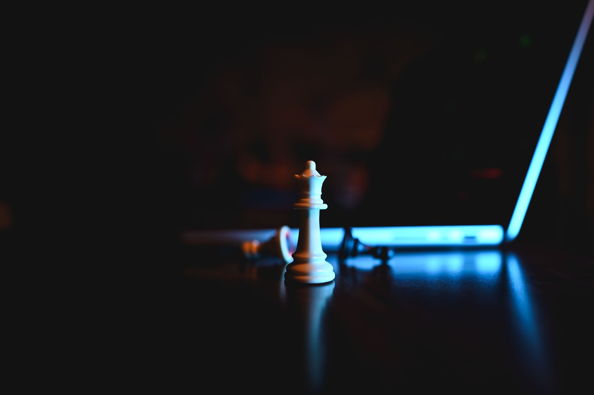 chess pieces and laptop.